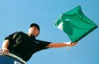 man-with-green-flag