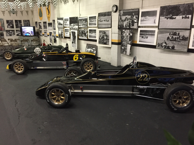Plenty of wall art to accent the beautiful lines of the vintage Formula Ford racers